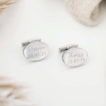 Oval shaped cufflinks etched with a name and date of birth