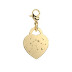 Gold heart-shaped pendant with star constellations on a white background
